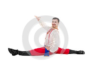 Man in folk ukrainian costume makes splits
