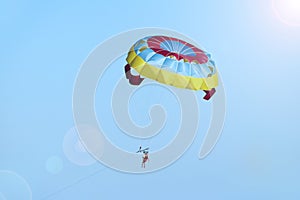 Man is fond of parasailing along sky. Free flying with parachute