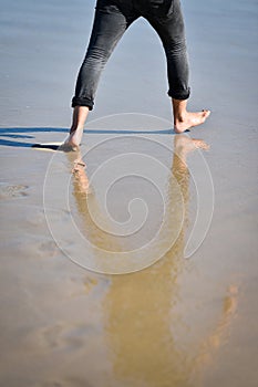 Man footprints in the sand on a beach