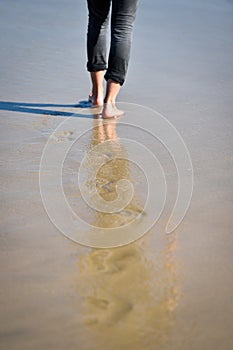 Man footprints in the sand on a beach