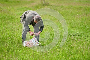 Man foraging for parasol mushrooms