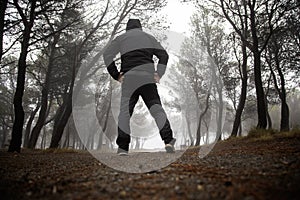 Man in forest with fog