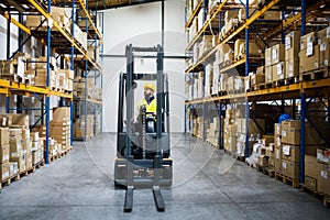 Warehouse man worker with forklift.