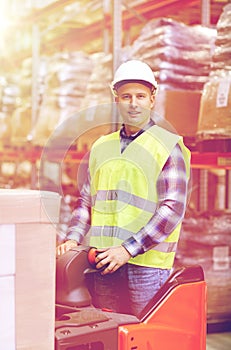 Man on forklift loading boxes at warehouse