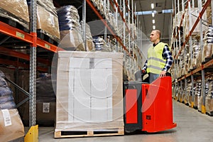 Man on forklift loading cargo at warehouse