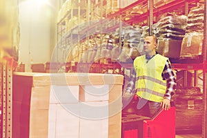 Man on forklift loading cargo at warehouse