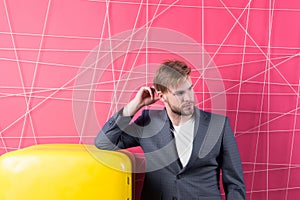 Man formal elegant suit lean on retro vintage yellow refrigerator. Bachelor elegant guy think what eat near fridge