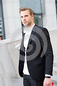 Man formal outfit businessman handsome well groomed urban background. Gentleman dressed professional attire mean serious