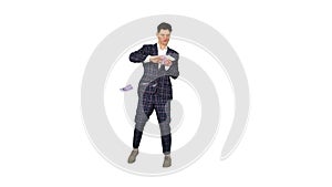 Man in formal suit walking in and throwing money in the air on white background.