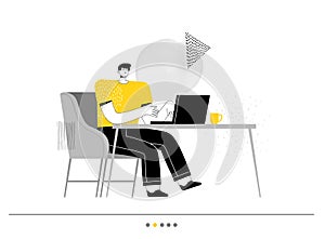 Man freelancer sits in the chair and working on a laptop. Business concept of office and productive work