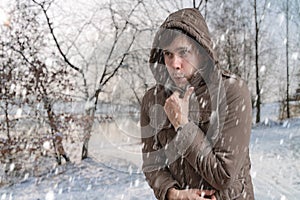 Man is freezing outside in cold winter