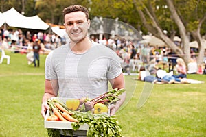 Man With Fresh Produce Bought At Outdoor Farmers Market