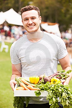 Man With Fresh Produce Bought At Outdoor Farmers Market