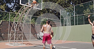 Man, friends and high five for goal in basketball court, score or point in game, match or sports at outdoor park. Group