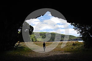 Man in front cave entrance