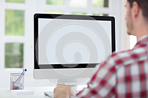 Man in front of computer screen