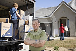Man In Front Of Delivery Van And House