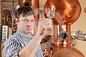 Man in front of distillery