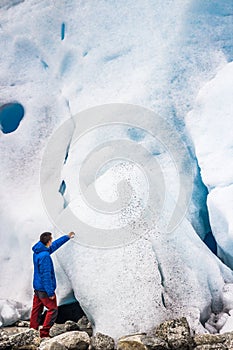 Man in front of a glacier