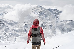 Man in front of a snowy landscape