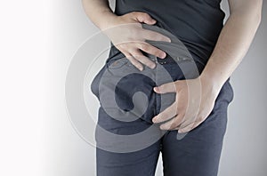 Man front view. Pain in the groin and bladder. The concept of pain in men as a result of prostatitis, inflammation of the bladder