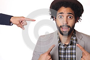 Man in front of a white background doing expressions