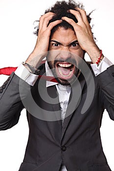 Man in front of a white background doing expressions