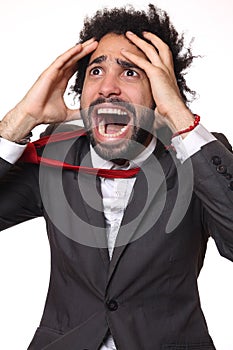 Man in front of a white background doing expressions