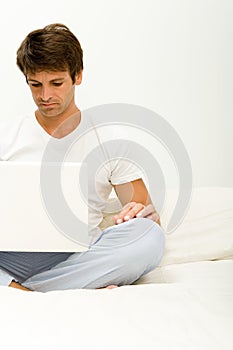 Man frowning at laptop computer