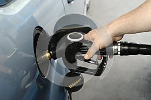 Man fueling car with diesel