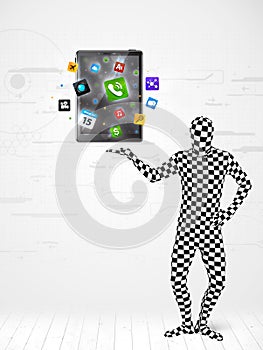 Man in full body suit holdig tablet pc