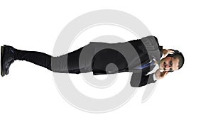 man in full growth. isolated on white background wearing headphones dancing