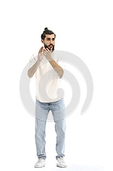 A man, full-length, on a white background, claps