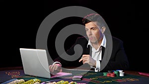 Man gamble in online casinos and lossing. Close up