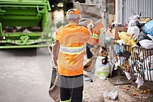 Man, garbage truck and trash collection on street for waste management in city for recycling plastic, junk or sanitation