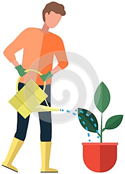Man gardener waters flower in pot from watering can. Guy takes care of green plant with big leaves