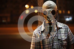 Man in a gas mask on night street