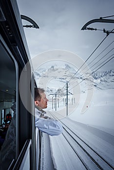 Man in Winter Jacket on Alpine Train, Zermatt Ski Resort