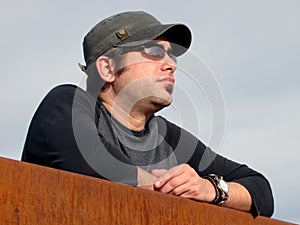 Man Gazing from Bridge photo