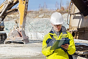 Man geologist or mining engineer at work