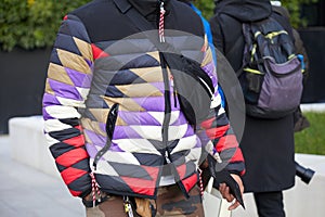 Man with geometric design padded jacket before Neil Barrett fashion show, Milan Fashion Week