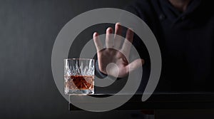 Man with a gesture refuses alcohol