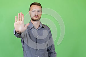 Man gesturing stop and rejection with hand