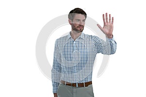 Man gesturing stop sign against white background