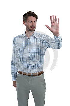 Man gesturing stop sign against white background