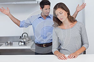 Man gesturing to wife during a dispute
