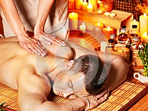 Man getting aroma massage in spa.