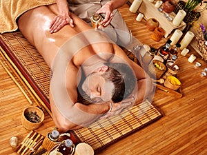 Man getting aroma massage in spa