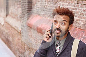 Man getting devastating news on the phone