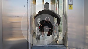 Man getting into elevator for disabled people